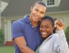African American couple with keys to their new house.