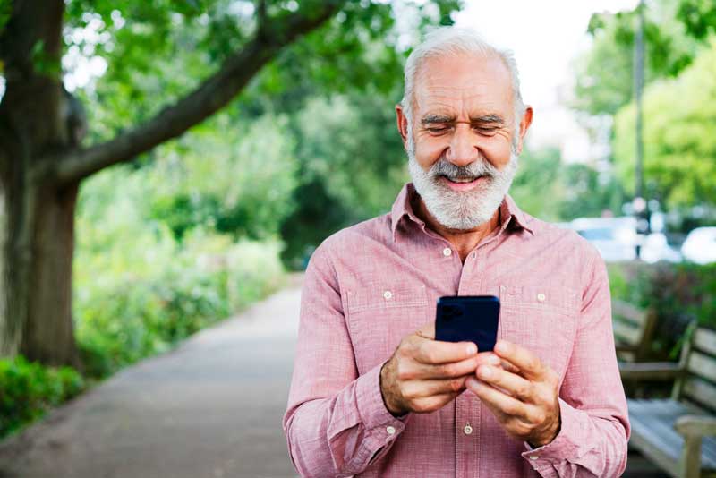 older man easily managing his certificate on his phone